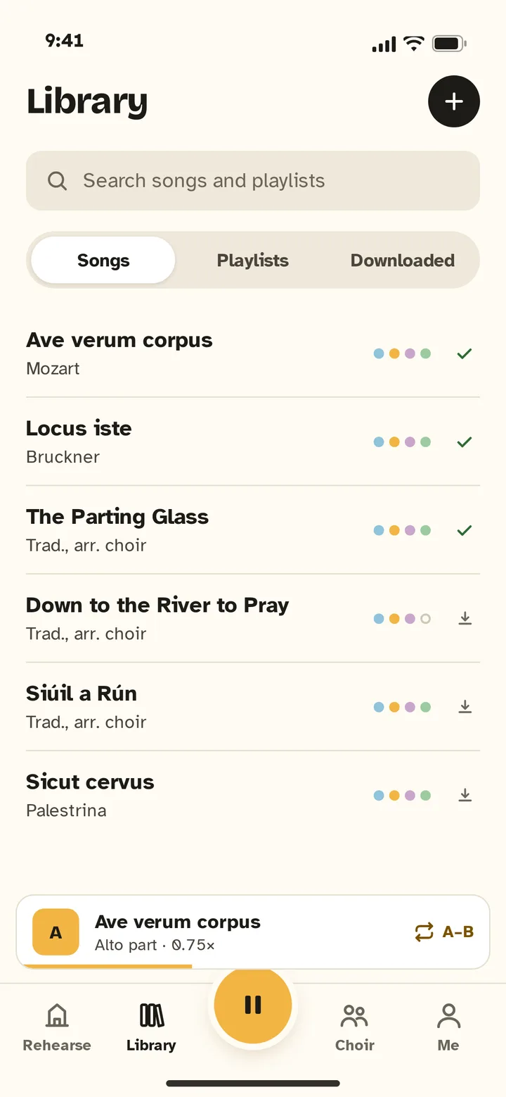 Library screen listing songs with coloured dots for each voice part and download ticks